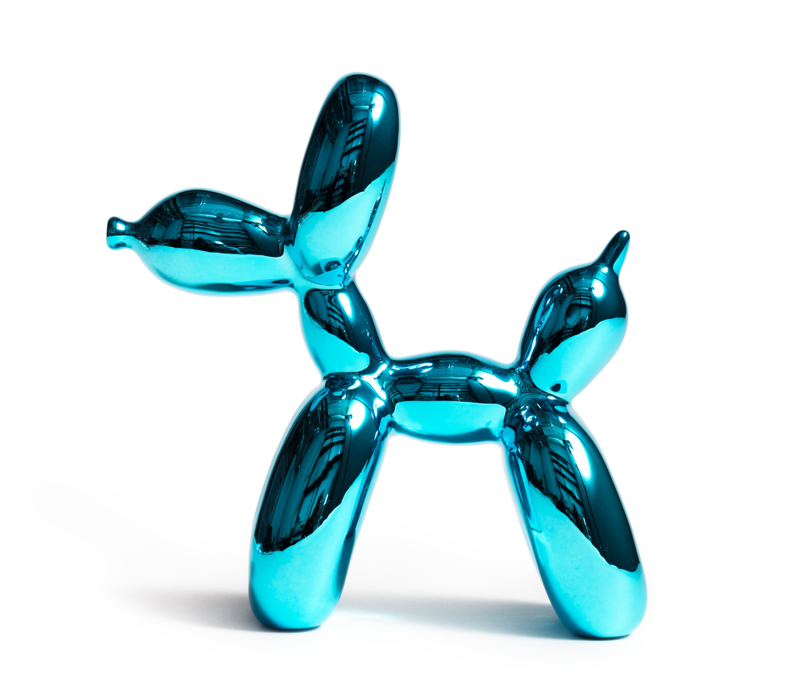 Sculpture of a turquoise-colored dog, formed from balloons, shiny, with a smooth surface and reflecting light.