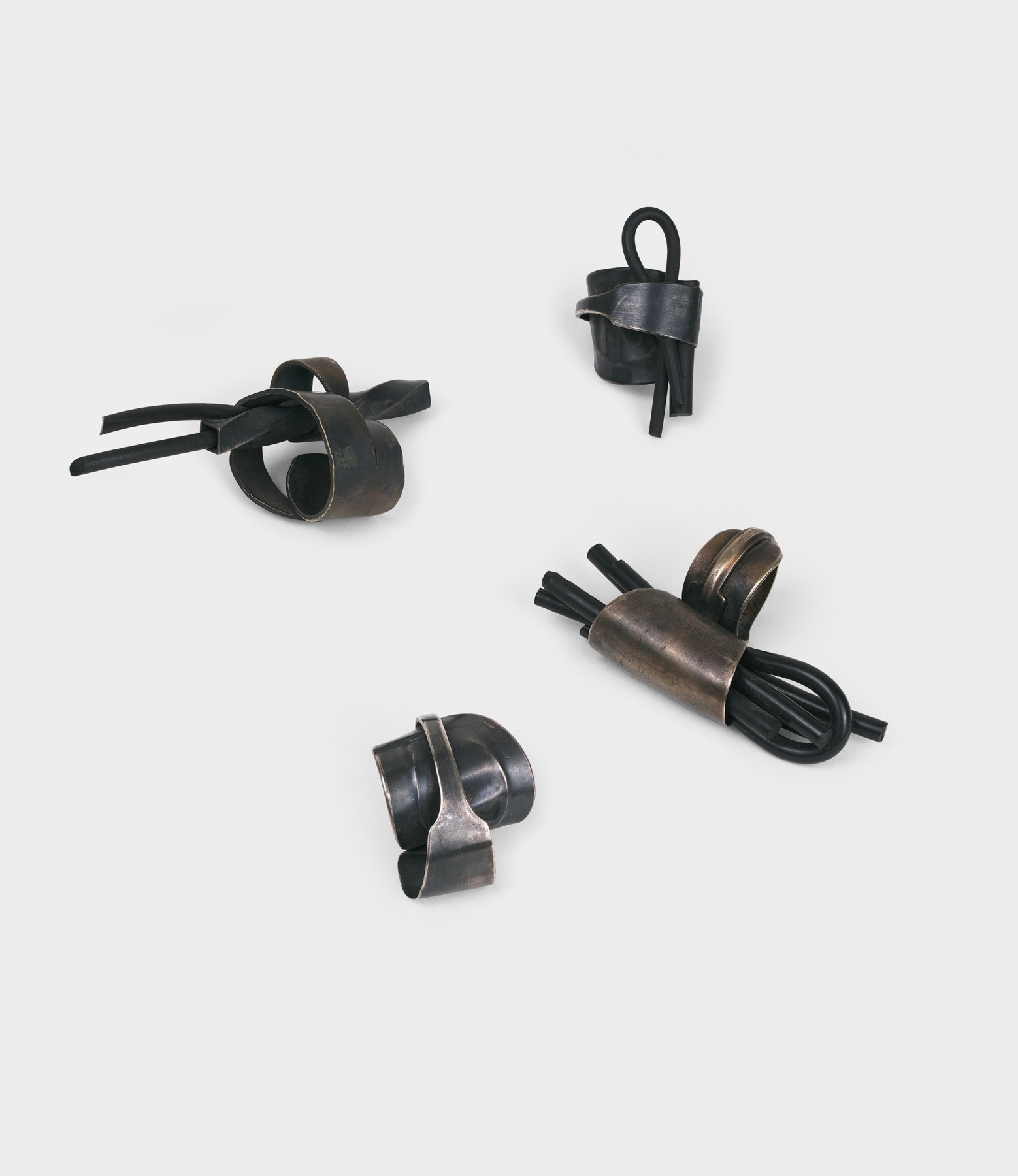 Four rings made with rubber and silver