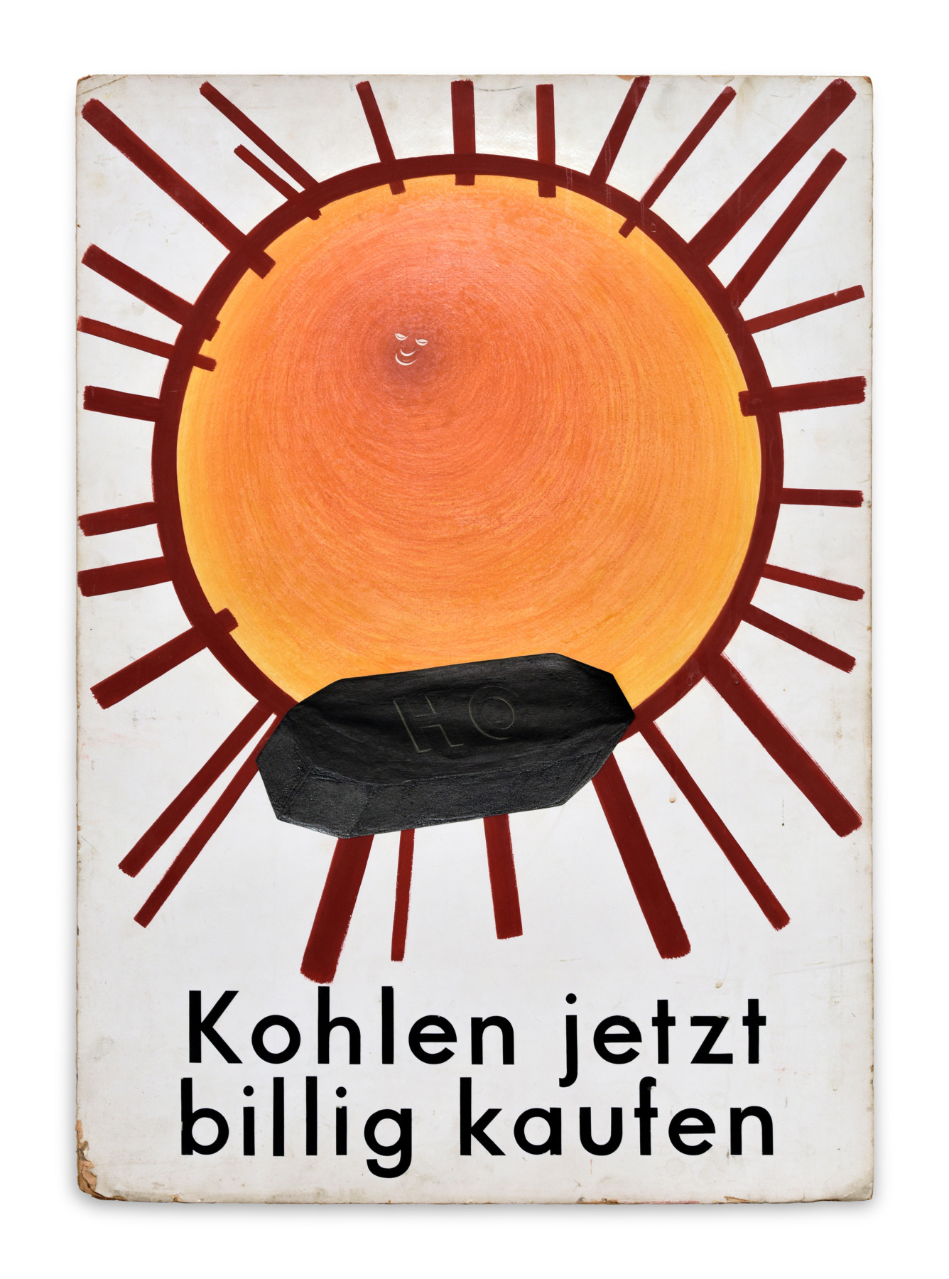 A coal briquette in front of the bright sun, with the words Buy coal cheap now