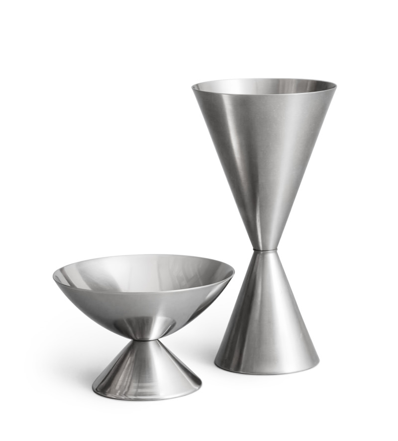 Two stainless steel cups with geometric designs against a white background